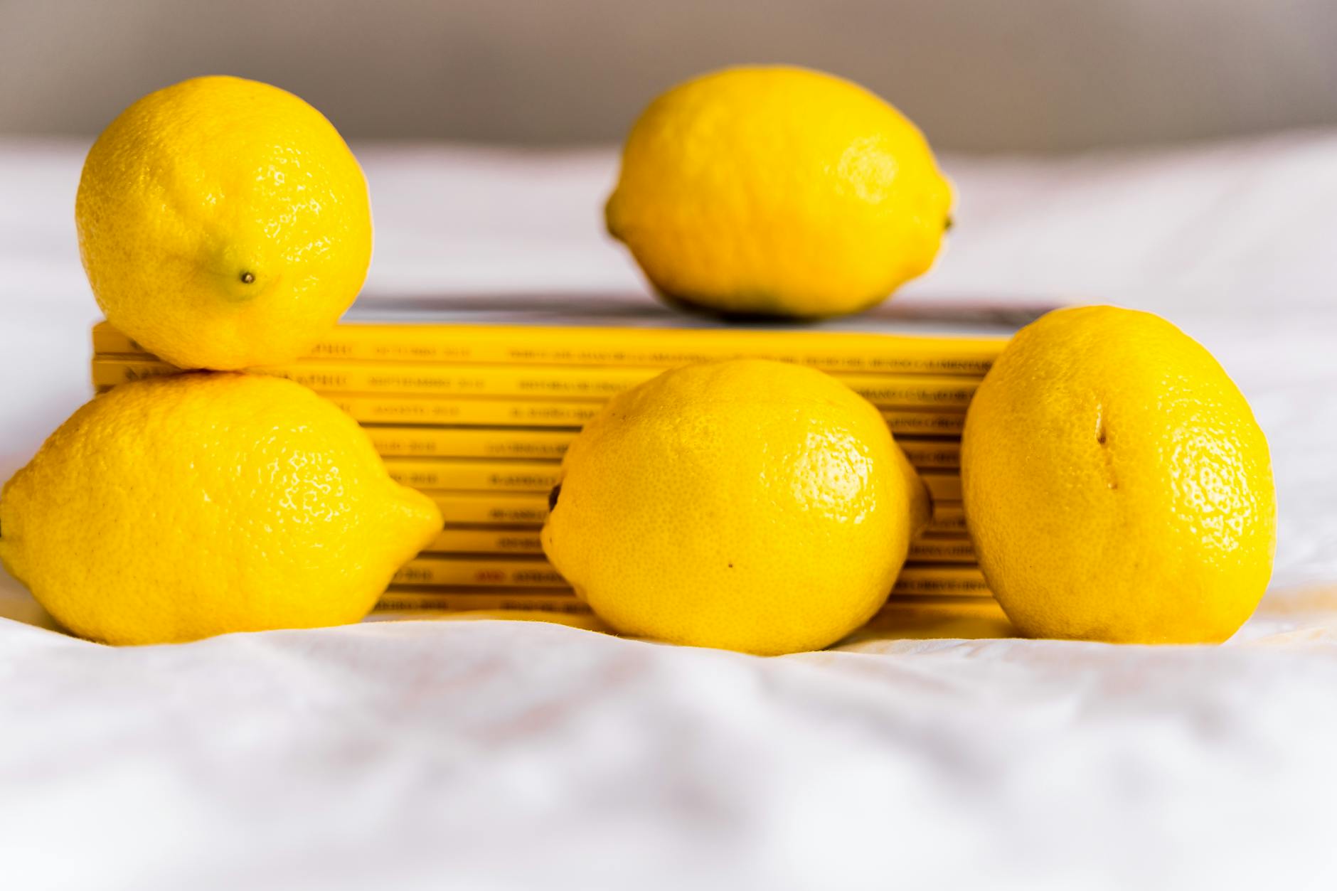 Close-up of hands holding a personal vibrator against a knitted sweater